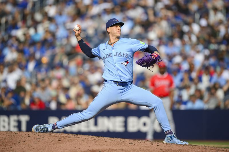 Toronto Blue Jays pitcher Bowden Francis throws during ninth inning of a baseball game against the Los Angeles Angels in Toronto, Saturday, Aug. 24, 2024. (Christopher Katsarov/The Canadian Press via AP)