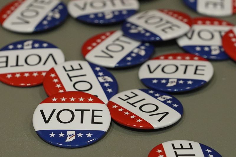 Vote buttons are displayed during a presidential debate between Democratic presidential nominee Vice President Kamala Harris and Republican presidential nominee former President Donald Trump, Tuesday, Sept. 10, 2024, in Muncie, Ind. (AP Photo/Darron Cummings)