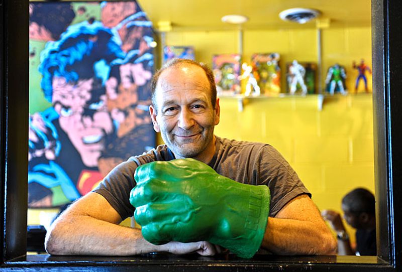 Savage Pizza co-owner Myron Monsky has decorated his Little Five Points restaurant, open since 1990, with superhero memorabilia. Becky Stein for The Atlanta Journal-Constitution