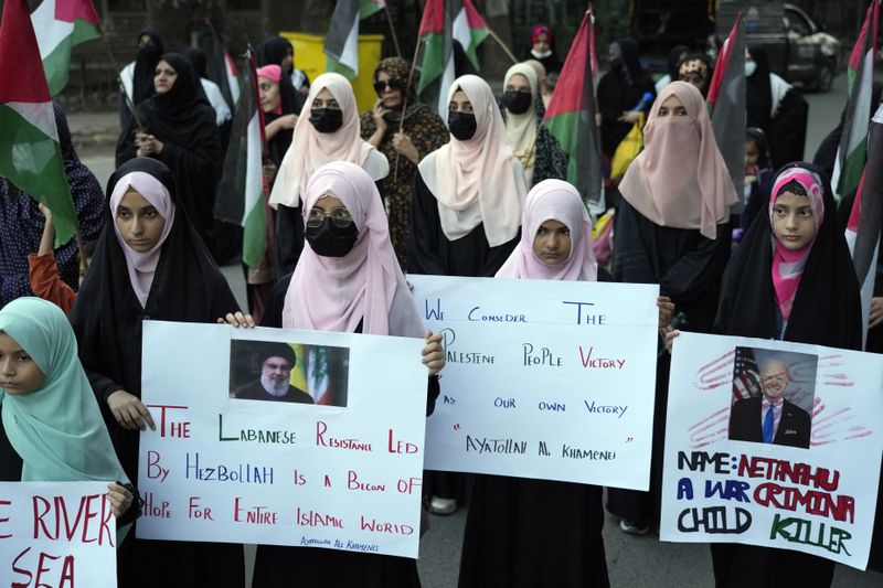 Supporters of a Pakistani Shiite Muslim group 'Imamia Student Organization' shout slogans during a protest against the killing of Hezbollah leader Hassan Nasrallah, in Lahore, Pakistan, Saturday, Sept. 28, 2024. (AP Photo/K.M. Chaudary)