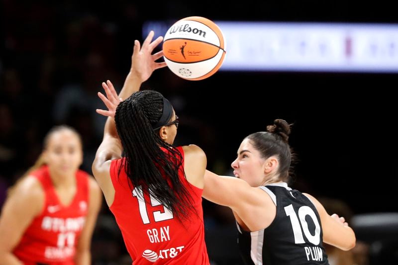 Atlanta Dream guard Allisha Gray (15) is fouled by Las Vegas Aces guard Kelsey Plum (10) during the first half of an WNBA basketball game Friday, Aug. 30, 2024 in Las Vegas. (Steve Marcus/Las Vegas Sun via AP)