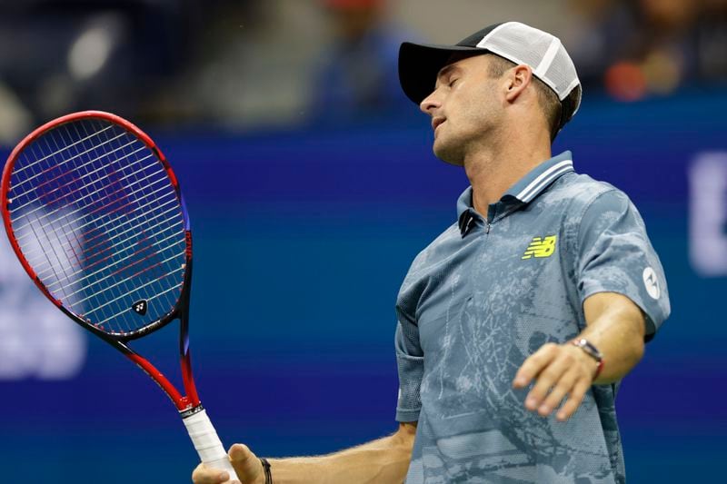 Tommy Paul, of the United States, reacts against Jannik Sinner, of Italy, during a fourth round match of the U.S. Open tennis championships, Monday, Sept. 2, 2024, in New York. (AP Photo/Adam Hunger)