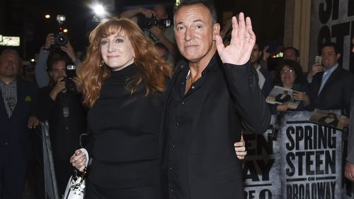 FILE - Musician Bruce Springsteen and his wife Patti Scialfa exit the stage door after the opening night performance of "Springsteen On Broadway" at the Walter Kerr Theatre in New York, Oct. 12, 2017. (AP Photo/Evan Agostini via Invision, File)