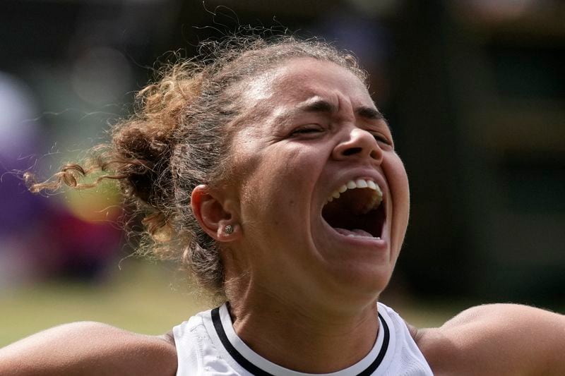 Jasmine Paolini of Italy celebrates after defeating Donna Vekic of Croatia in their semifinal match at the Wimbledon tennis championships in London, Thursday, July 11, 2024. (AP Photo/Mosa'ab Elshamy)