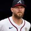 Atlanta Braves pitcher Chris Sale (51) watches the jumbotron as he is introduced to receive the Roberto Clemente award before the Atlanta Braves and Los Angeles Dodgers game at Truist Park. 
(Miguel Martinez/ AJC)