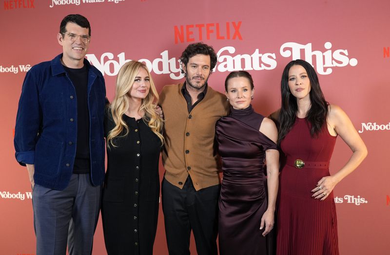 FILE - Timothy Simons, from left, Justine Lupe, Adam Brody, Kristen Bell and Jackie Tohn, cast members in "Nobody Wants This," pose together at a photo call for the Netflix series at The Aster hotel, Wednesday, Sept. 18, 2024, in Los Angeles. (AP Photo/Chris Pizzello, File)