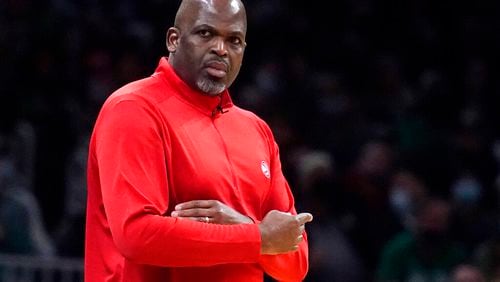 Atlanta coach Nate McMillan signals to his players during the second half Tuesday night in Boston. (AP Photo/Charles Krupa)