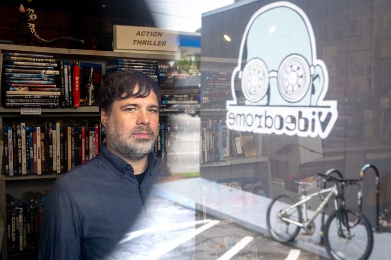 Videodrome owner Matt Booth poses for a portrait at the video rental store in Atlanta on Thursday, June 22, 2023. (Arvin Temkar / arvin.temkar@ajc.com)