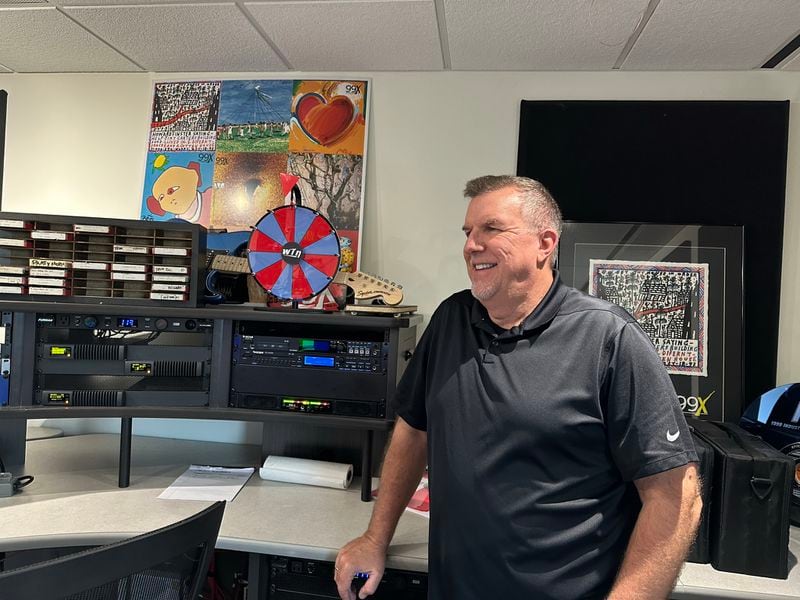 Steve Craig in the studio at Cumulus Atlanta. It's not the same space as he had when he last left but it is now decorated in 99X memorabilia. RODNEY HO/rho@ajc.com