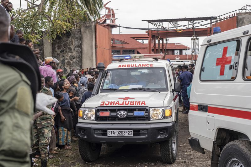 An ambulance carries victims away from the port of Goma, Democratic Republic of Congo, after a ferry carrying hundreds capsized on arrival Thursday, Oct. 3, 2024. (AP Photo/Moses Sawasawa)