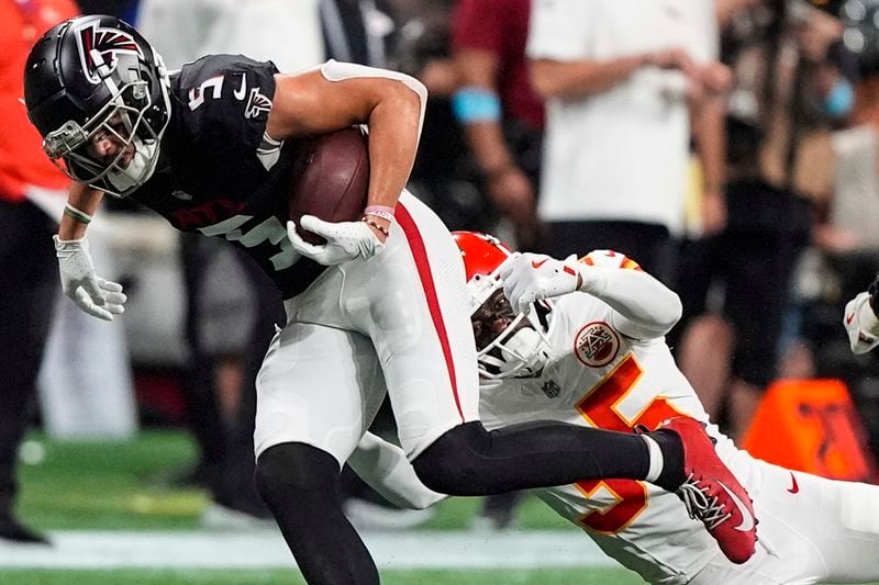 Atlanta Falcons wide receiver Drake London (5) runs against Kansas City Chiefs cornerback Jaylen Watson (35) during the second half of an NFL football game, Sunday, Sept. 22, 2024, in Atlanta. (AP Photo/Brynn Anderson)