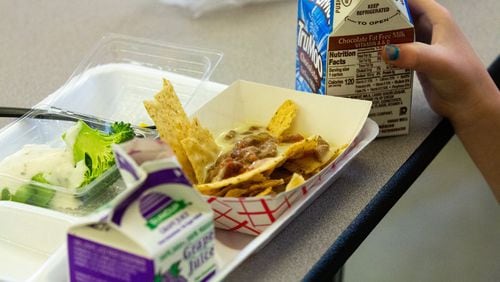 Students at Hickory Hills Elementary School in Marietta, Georgia, enjoy their lunch on Tuesday, Jan. 21, 2020. Many children in Georgia still cannot afford the standard lunch and either accure lunch debt or are fed an alternate meal.