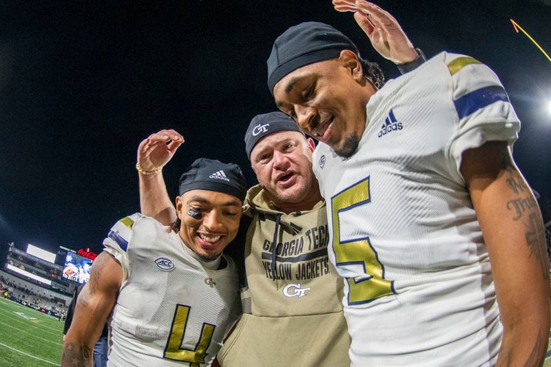 FILE - Georgia Tech head coach Brent Key hugs running back Dontae Smith (4) and defensive back Clayton Powell-Lee (5) after victory over Syracuse in an NCAA college football game Saturday, Nov. 18, 2023, in Atlanta. (AP Photo/Hakim Wright Sr., File)