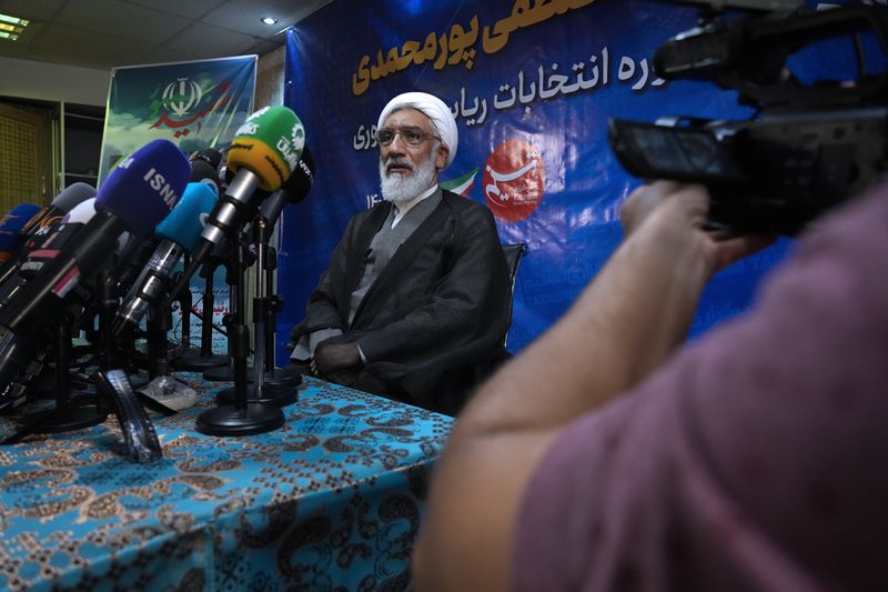 Candidate for June 28, Iran's presidential election Mostafa Pourmohammadi, a former Minister of Justice, sits in his press conference in Tehran, Iran, Sunday, June 23, 2024. (AP Photo/Vahid Salemi)