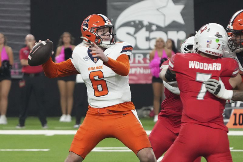 Syracuse quarterback Kyle McCord (6) looks to throw downfield against UNLV in the first half during an NCAA college football game, Friday, Oct. 4, 2024, in Las Vegas. (AP Photo/Rick Scuteri)