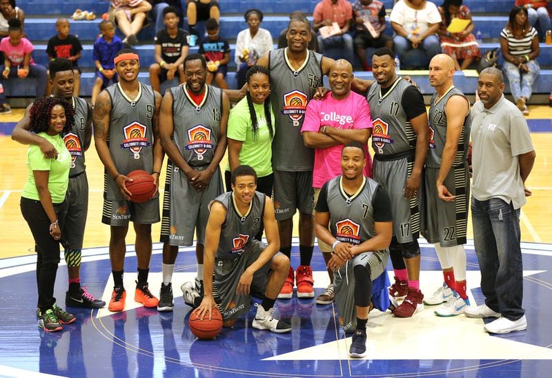 May 20, 2017, Atlanta: Dikembe Mutombo gathers his team for a group photo during the Breakthrough Atlanta Celebrity Basketball Game at the Lovett School on Saturday, May 20, 2017, in Atlanta.     Curtis Compton/ccompton@ajc.com