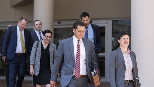 Department of Justice attorneys leave the Edward A. Garmatz United States District Courthouse in Baltimore, Thursday, June 20, 2024. (AP Photo/Stephanie Scarbrough)