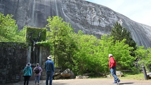 April 20, 2021 Stone Mountain - Park goers walk around Valor Park were Statue of Valor is located at Stone Mountain Park on Tuesday, April 20, 2021. (Hyosub Shin / Hyosub.Shin@ajc.com)