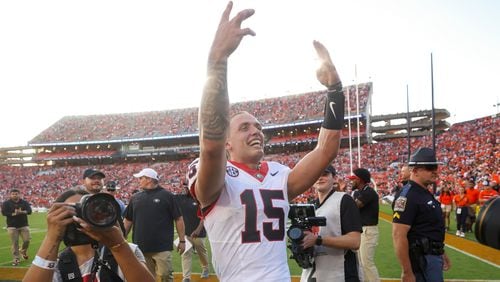 Georgia quarterback Carson Beck (15) celebrates their win against Auburn at Jordan-Hare Stadium, Saturday, Sept. 30, 2023, in Auburn, Al. Georgia won 27-20.  Beck had 318 yards passing and the go-ahead touchdown. (Jason Getz / Jason.Getz@ajc.com)