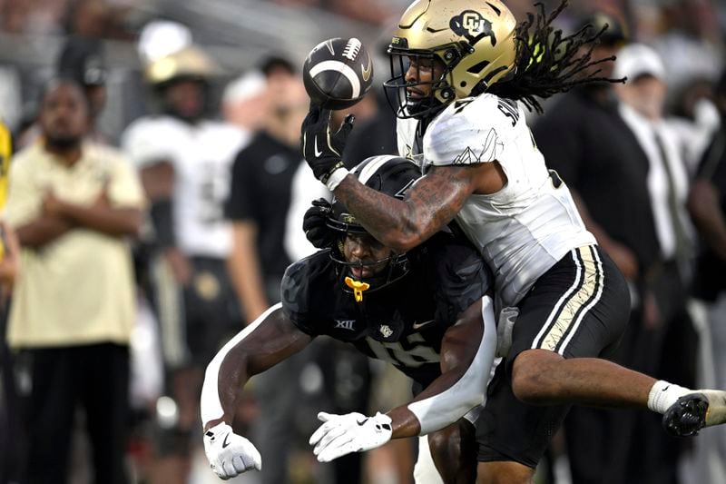 Colorado safety Cam'Ron Silmon-Craig (7) breaks up a pass intended for Central Florida wide receiver Jacoby Jones (16) during the second half of an NCAA college football game, Saturday, Sept. 28, 2024, in Orlando, Fla. (AP Photo/Phelan M. Ebenhack)