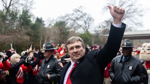 Georgia Bulldog Coach Kirby Smart waves to fans during the Dawg Walk as part of the team’s celebration parade in Athens, Georgia on January 15th, 2022.(Nathan Posner for The Atlanta Journal-Constitution)