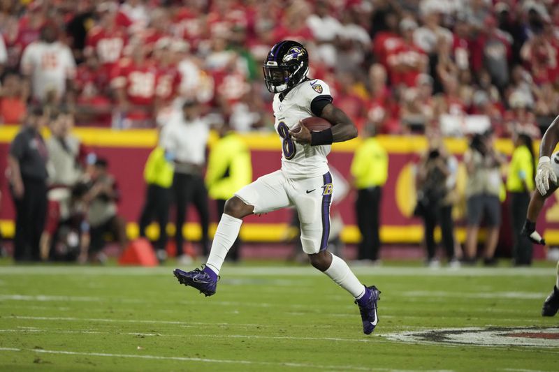 Baltimore Ravens quarterback Lamar Jackson runs with the ball during the first half of an NFL football game against the Kansas City Chiefs Thursday, Sept. 5, 2024, in Kansas City, Mo. (AP Photo/Charlie Riedel)