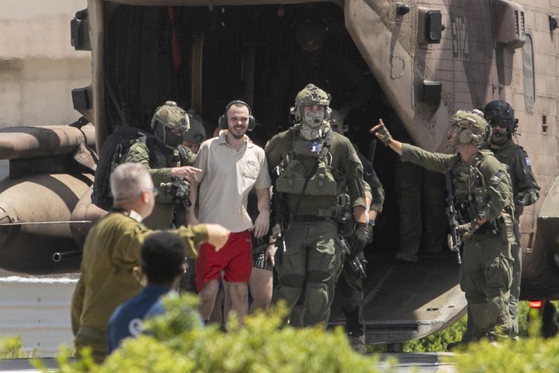 Andrey Kozlov, 27, one of four hostages who were kidnapped in a Hamas-led attack on Oct. 7, 2023 and was just rescued, arrives by helicopter to the Sheba Medical Center in Ramat Gan, Israel, Saturday, June 8, 2024. Israel says it has rescued four hostages who were kidnapped in a Hamas-led attack on Oct. 7. It is the largest such hostage recovery operation since the war with Hamas began in Gaza. (AP Photo/Tomer Appelbaum)