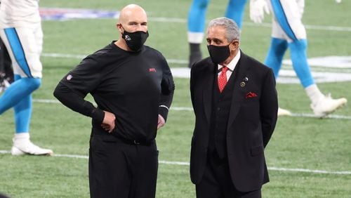 Falcons head coach Dan Quinn (left) and team owner Arthur Blank talk before game against the Carolina Panthers Sunday, Oct. 11, 2020, at Mercedes-Benz Stadium in Atlanta. (Jason Getz/For the AJC)