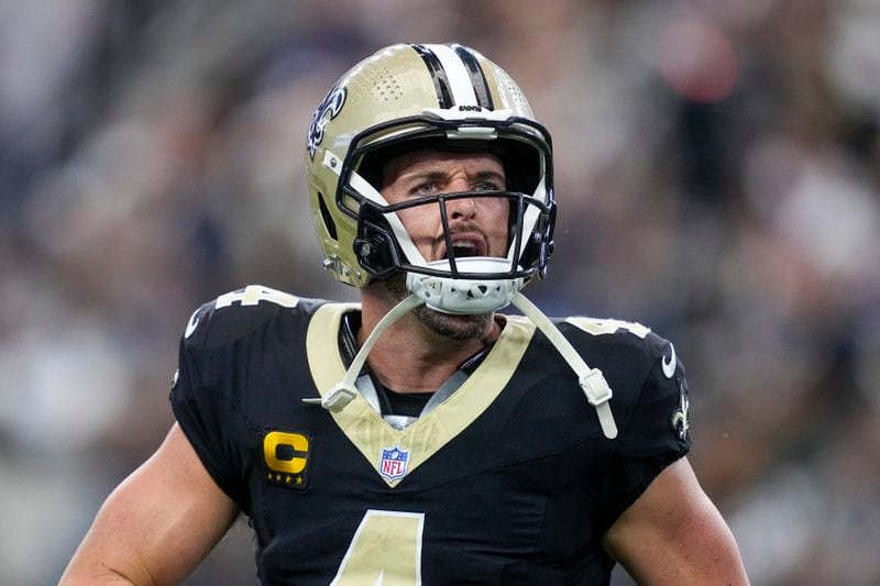 New Orleans Saints quarterback Derek Carr reacts after throwing a touchdown pass to wide receiver Rashid Shaheed during the first half of an NFL football game against the Dallas Cowboys, Sunday, Sept. 15, 2024, in Arlington, Texas. (AP Photo/Tony Gutierrez)