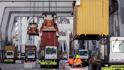 Longshoremen load and unload containers at the Georgia Ports Authority Garden City Terminal. (AJC Photo/Stephen B. Morton)