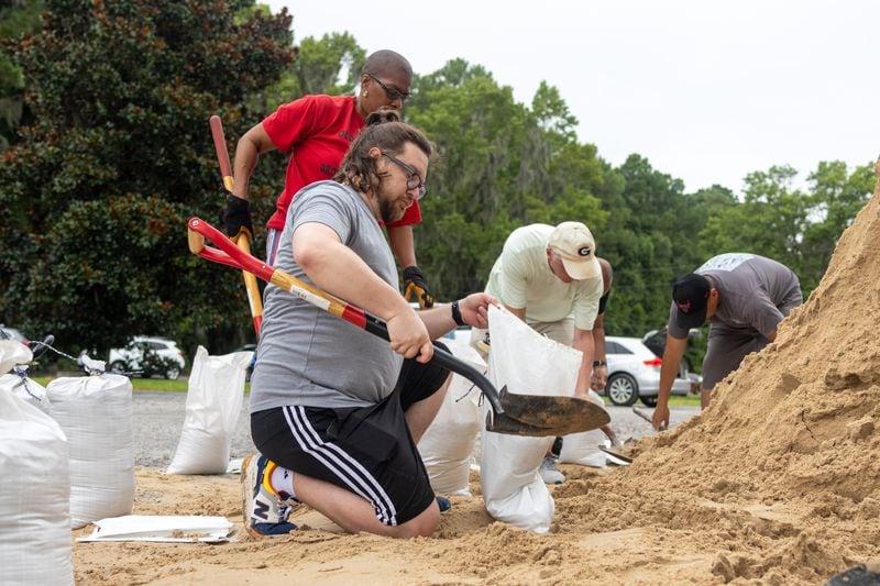 David Shaver fills sand bags with sand at the Savannah Fire Station #7 on Sunday, August 4, 2024 in Savannah, GA. (AJC Photo/Katelyn Myrick)