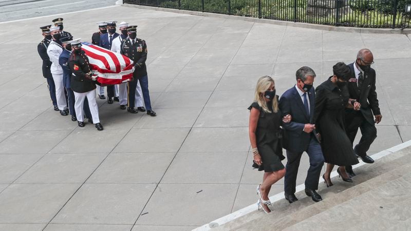 7/29/20 - Atlanta, GA - Georgia First Lady Mary Kemp (from left), Gov. Brian Kemp, Atlanta Mayor Keisha Lance Bottoms, State Rep. Calvin Smyre, lead the body of Rep. John Lewis into the state capitol.  On the fifth day of the “Celebration of Life” for Rep. John Lewis, Lewis’s body and and family members returned to Georgia for ceremonies at the State Capitol where he will also lie in state until his funeral on Thursday.  Alyssa Pointer / alyssa.pointer@ajc.com