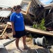 Laurie Lilliott stands amid the wreckage of her destroyed home in Dekle Beach in rural Taylor County, Fla., Friday, Sept. 27, 2024, in the aftermath of Hurricane Helene. (AP Photo/Kate Payne)