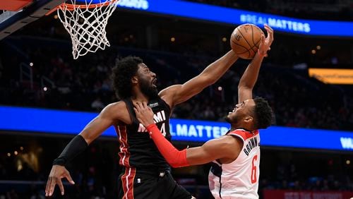 Miami forward Solomon Hill (44) blocks Washington forward Troy Brown Jr. (6) during the second half Sunday, March 8, 2020, in Washington. (Nick Wass/AP)