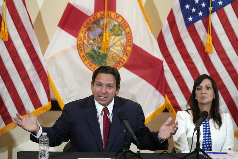 Florida Gov. Ron DeSantis gestures as he answers questions along with Lt. Gov. Jeanette Nuñez, after a roundtable discussion at the Roberto Alonso Community Center, Monday, Sept. 9, 2024, in Miami Lakes, Fla. (AP Photo/Wilfredo Lee)