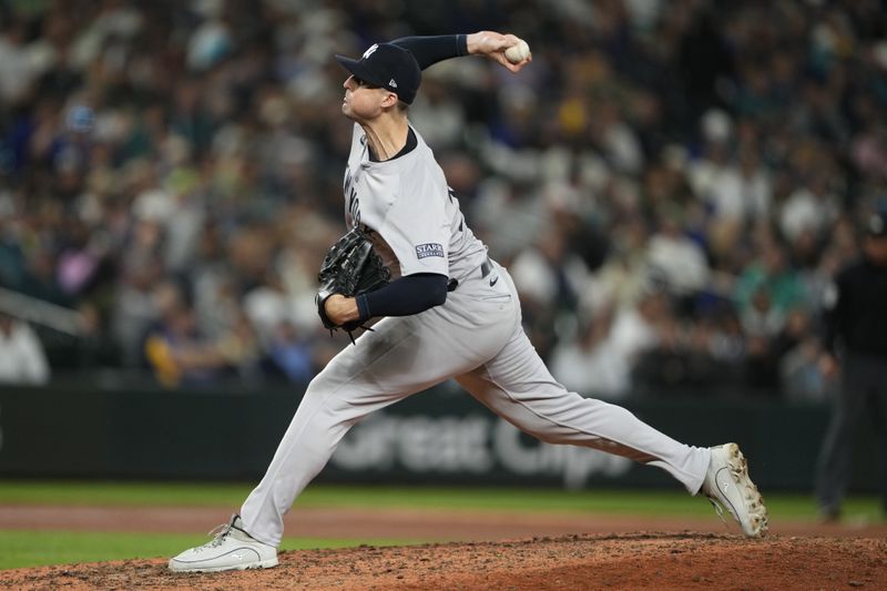 New York Yankees relief pitcher Clay Holmes throws against the Seattle Mariners during the eighth inning of a baseball game Wednesday, Sept. 18, 2024, in Seattle. (AP Photo/Lindsey Wasson)