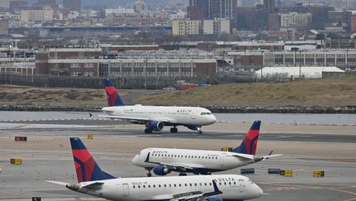 Delta Airlines planes taxi at LaGuardia airport in New York on Jan. 11, 2023. (Ed Jones/AFP/Getty Images/TNS)