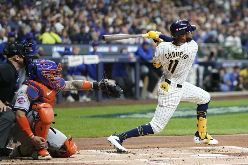 Milwaukee Brewers' Jackson Chourio hits a home run during the first inning of Game 2 of a National League wild card baseball game against the New York Mets Wednesday, Oct. 2, 2024, in Milwaukee. (AP Photo/Morry Gash)