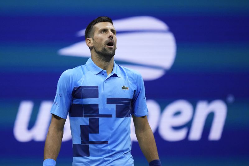 Novak Djokovic, of Serbia, reacts against Alexei Popyrin, of Australia, during a third round match of the U.S. Open tennis championships, Friday, Aug. 30, 2024, in New York. (AP Photo/Julia Nikhinson)