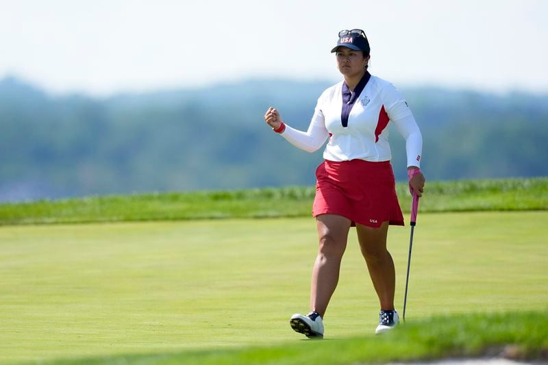 United States' Lilia Vu reacts after making a putt on the 17th green during a Solheim Cup golf tournament singles match at the Robert Trent Jones Golf Club, Sunday, Sept. 15, 2024, in Gainesville, Va. (AP Photo/Chris Szagola)