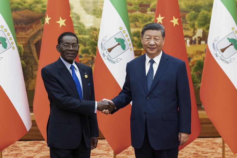 In this photo released by Xinhua News Agency, Chinese President Xi Jinping, right, meets with Equatorial Guinea President Teodoro Obiang Nguema Mbasogo at the Great Hall of the People in Beijing, Wednesday, Sept. 4, 2024, ahead of the China Africa Forum. (Huang Jingwen/Xinhua via AP)