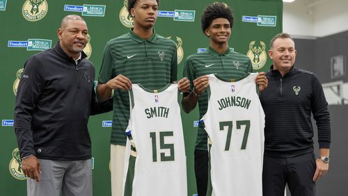 Milwaukee Bucks 2024 draft picks AJ Johnson and Tyler Smith pose for a picture with head coach Doc Rivers and general manager Jon Horst at a news conference Tuesday, July 2, 2024, in Milwaukee. (AP Photo/Morry Gash)