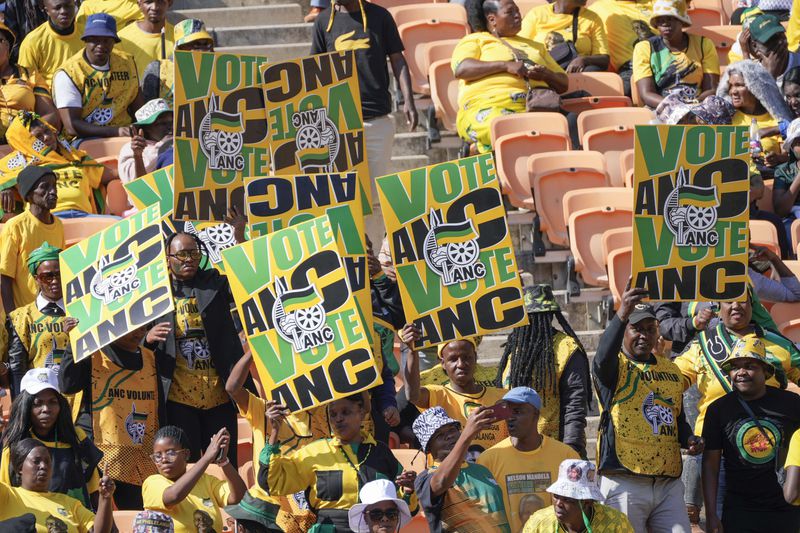 African National Congress supporters wait for South African President Cyril Ramaphosa to arrive at the Siyanqoba rally at FNB stadium in Johannesburg, South Africa, Saturday, May 25, 2024. South African will vote in the 2024 general elections on May 29. (AP Photo/Jerome Delay)