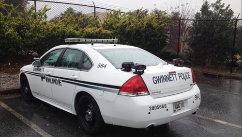 Snow accumulated on a police cruiser in Norcross around 10:30 a.m. Friday.