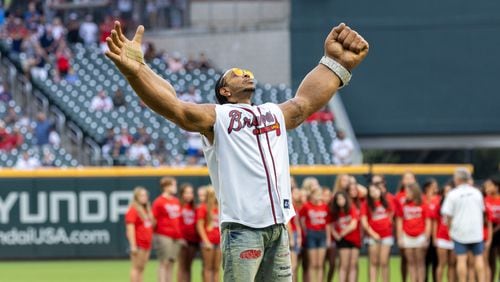 Rapper Ludacris throws the ceremonial first pitch before the Braves versus Colorado Rockies game at Truist Park in Atlanta on Wednesday, September 4, 2024. The Braves won 5-2. (Arvin Temkar / AJC)