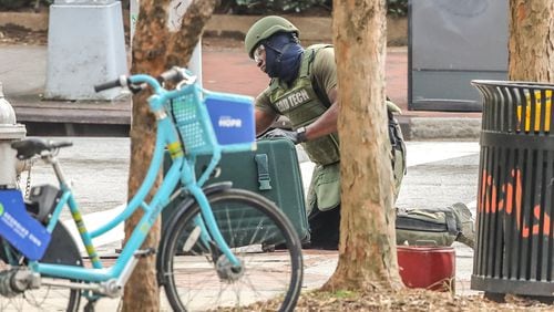 Atlanta police investigated a suspicious suitcase Monday morning. It was found near an Underground Atlanta parking deck at the corner of Martin Luther King Jr. Drive and Pryor Street. (John Spink / John.Spink@ajc.com)