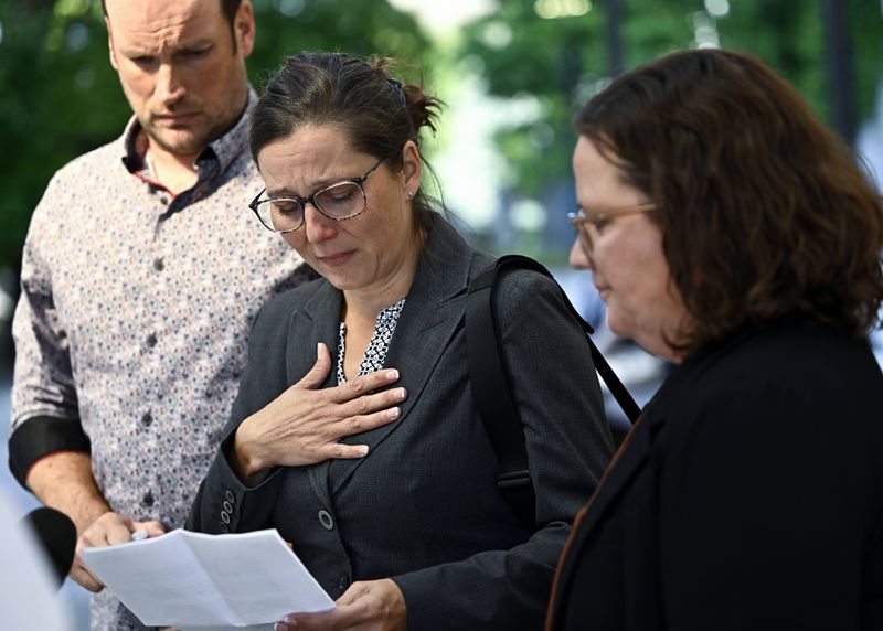 Stephanie Viau makes a statement to journalists outside the courthouse after former Vice Adm. Haydn Edmundson was found not guilty of sexual assault and an indecent act, Monday, Sept. 16, 2024, in Ottawa. (Justin Tang/The Canadian Press via AP)