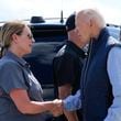 President Joe Biden talks with Deanne Criswell, Administrator of the Federal Emergency Management Agency (FEMA), as he arrives at Greenville-Spartanburg International Airport in Greer, S.C., Wednesday, Oct. 2, 2024, to survey damage from Hurricane Helene. (AP Photo/Susan Walsh)