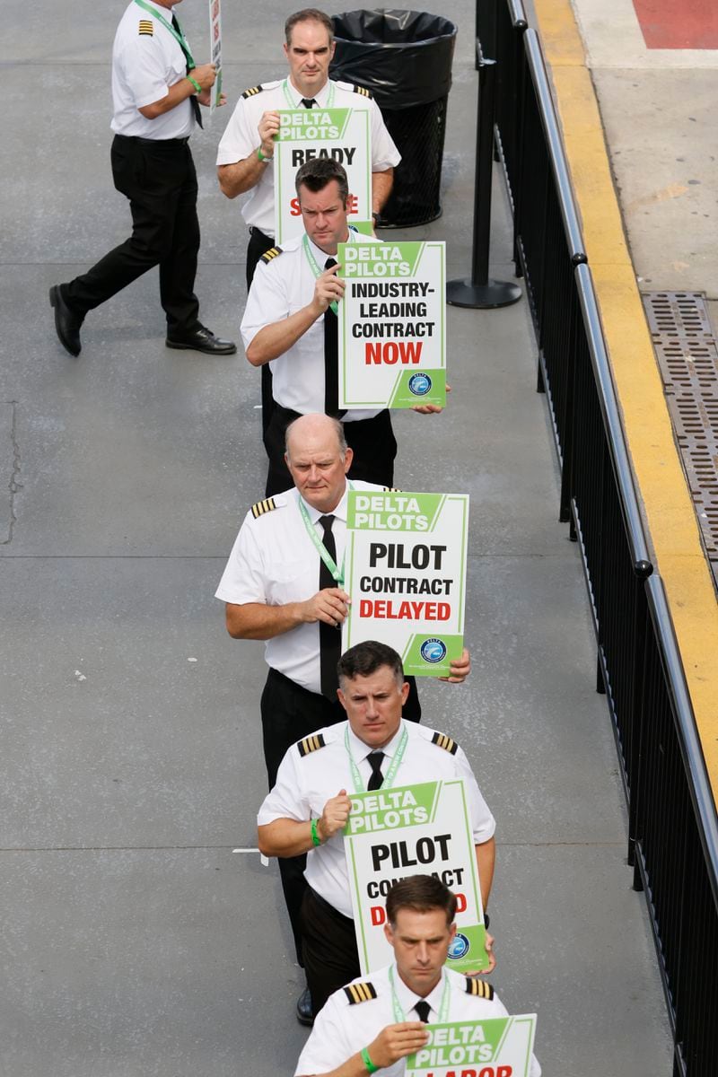 Delta Airline Pilots are seen picketing at Domestic South Terminal at Hartsfield-Jackson International Airport on Thursday, June 30, 2022. Delta Pilots in Atlanta joined the nationwide protest to send a clear message to Delta management that it is time to renegotiate their contracts. Miguel Martinez / Miguel.martinezjimenez@ajc.com