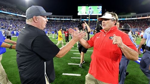 Georgia head coach Kirby Smart and Kentucky head coach Mark Stoops shake hands after Georgia beat Kentucky during an NCAA football game at Kroger Field, Saturday, September 14, 2024,  in Lexington, Kentucky. Georgia won 13-12 over Kentucky. (Hyosub Shin / AJC)